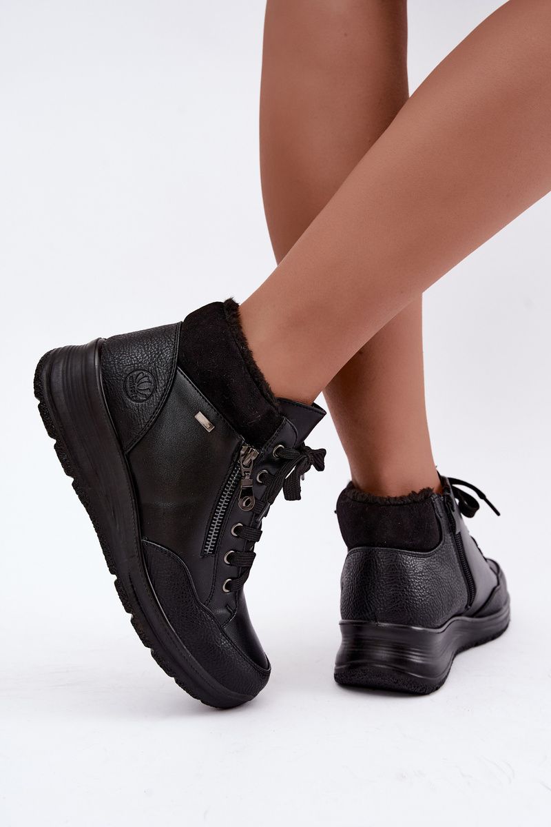 Schwarze Keilabsatz-Stiefelette mit Fellfutter