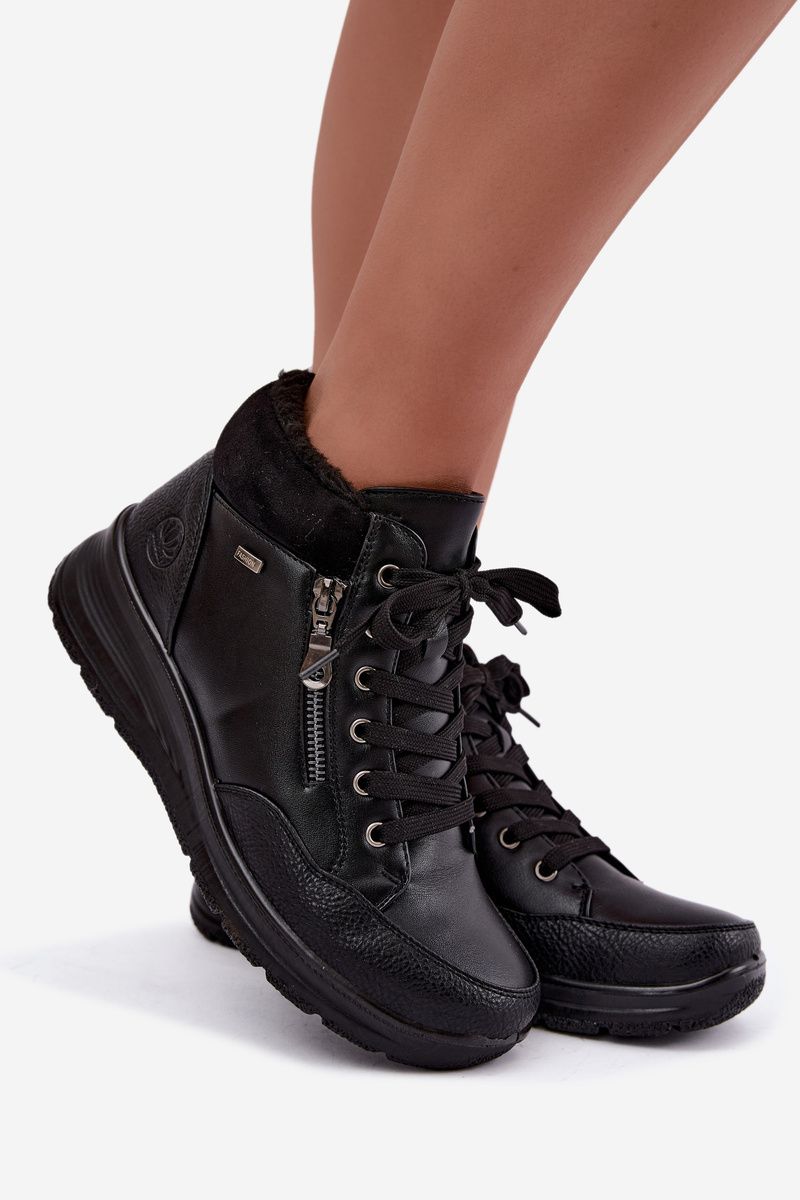 Schwarze Keilabsatz-Stiefelette mit Fellfutter