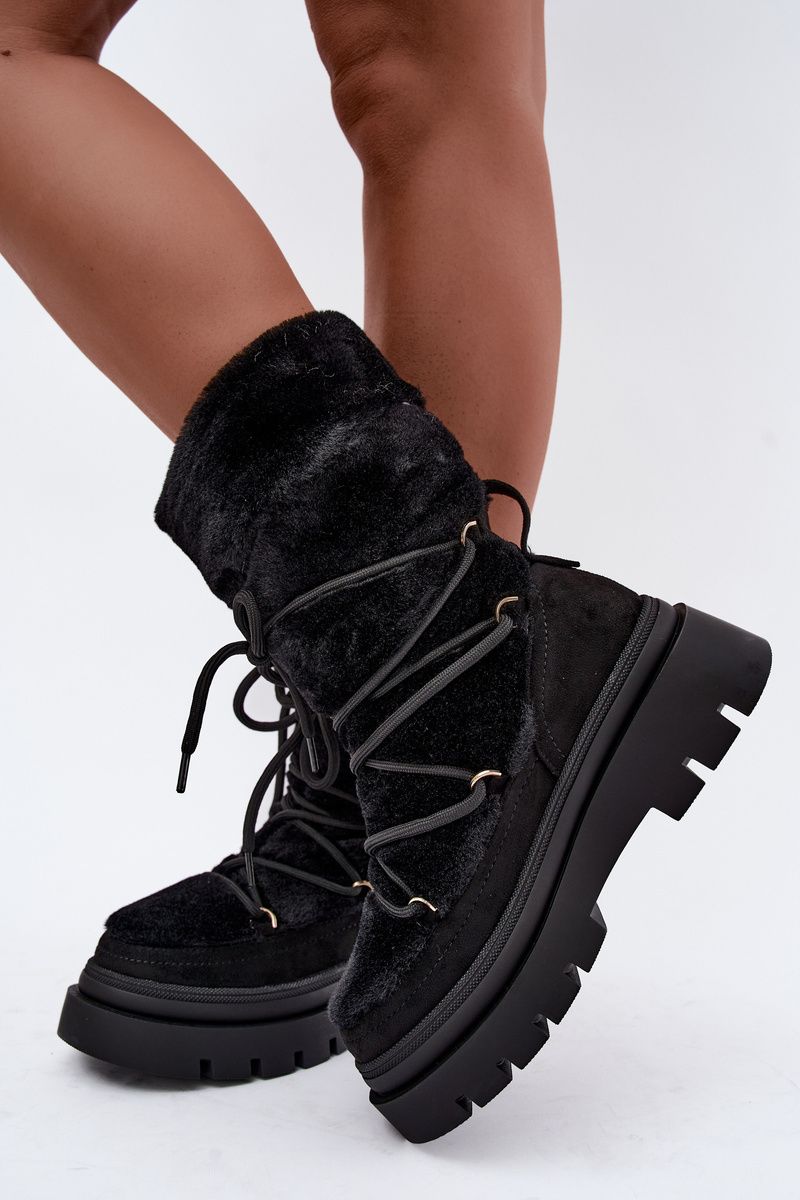 Schwarze Schneestiefel mit Fellbesatz und Plateausohle
