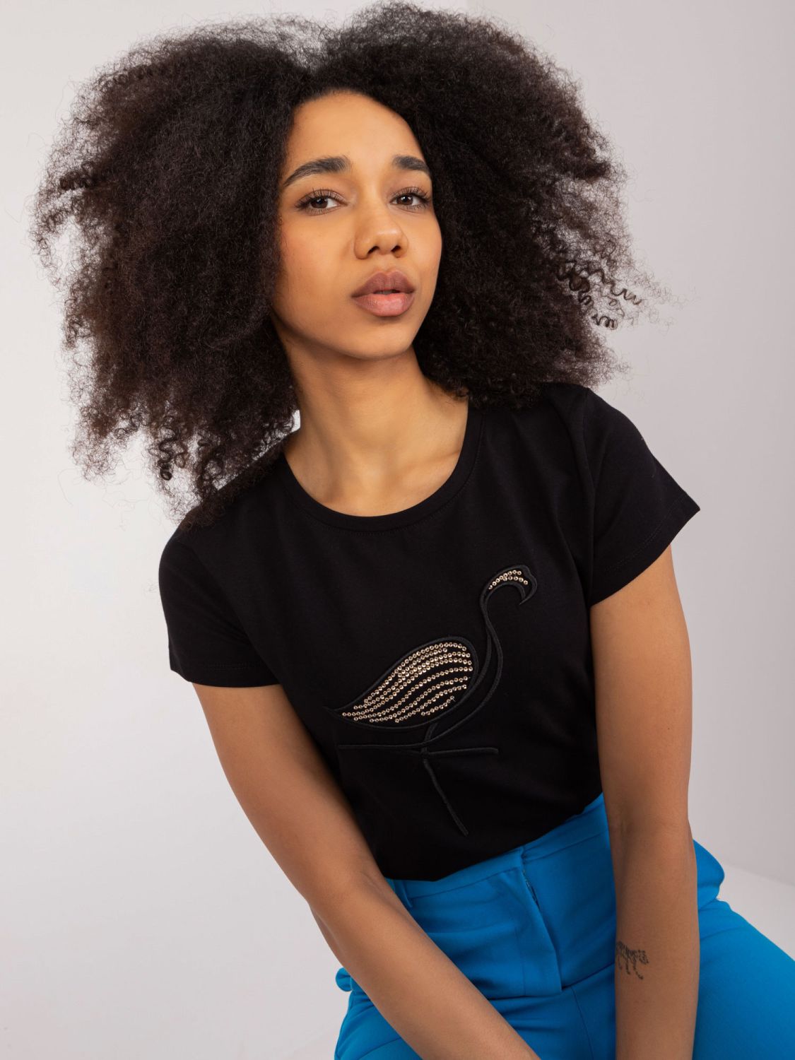 Stylische schwarze Bluse mit Applikation