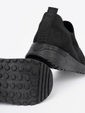 Schwarze Slip-On Sneakers