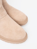 Stilvolle beige Stiefeletten mit dekorativen Schnallen