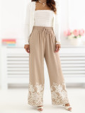 Beige weite Hose mit Stickerei