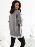 Eleganter grauer Strickpullover mit Spitze und Bindegürtel