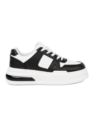 Stylische schwarz-weiße Sneakers mit dicker Sohle