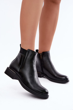 Gefütterte schwarze Stiefelette aus Kunstleder mit flachem Absatz